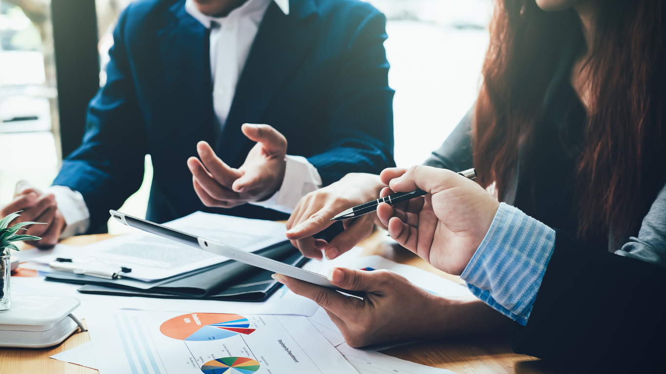 People planning and in front of charts